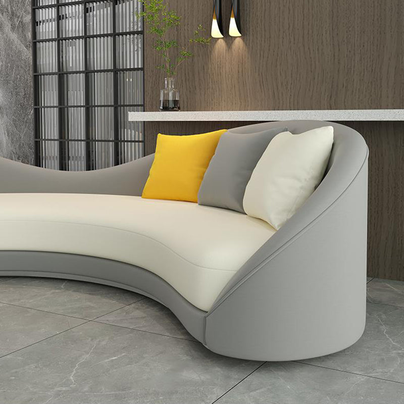 Contemporary Sloped Arm Curved Sofa Faux Leather Camel Back Sofa