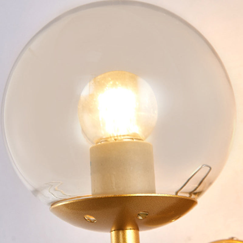 Clear Globe Shade Wall Sconce Metal Contemporary Wall Armed Light in Black / Gold