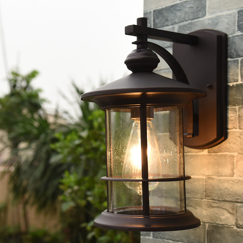 Cylindre en verre à graines à grève transparente Lodges légers 1-Bulb Lampe murale extérieure en noir / café pour jardin