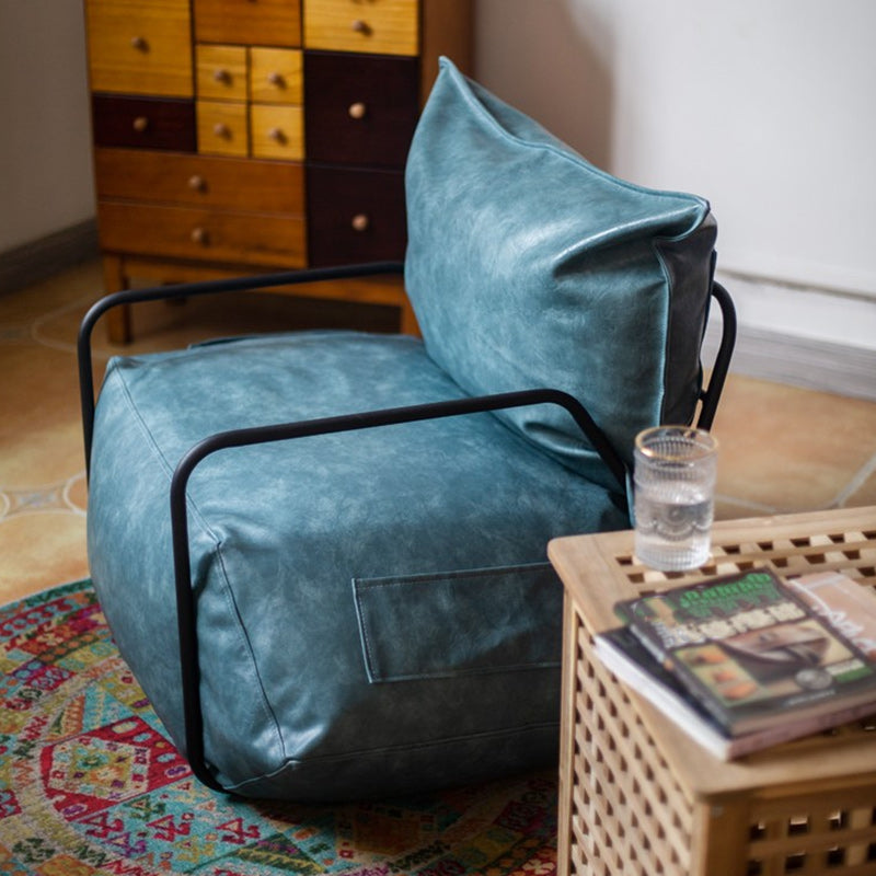 Contemporary Armchair Pillow Back Round Arms with Black Legs Leather Arm Chair