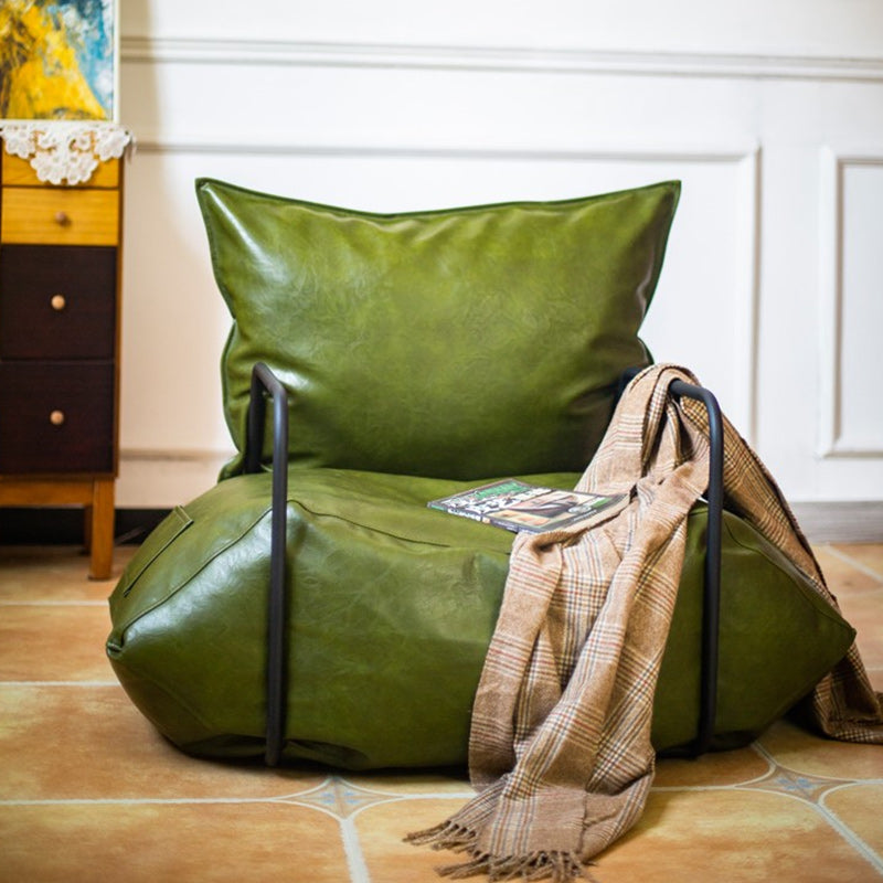 Contemporary Armchair Pillow Back Round Arms with Black Legs Leather Arm Chair