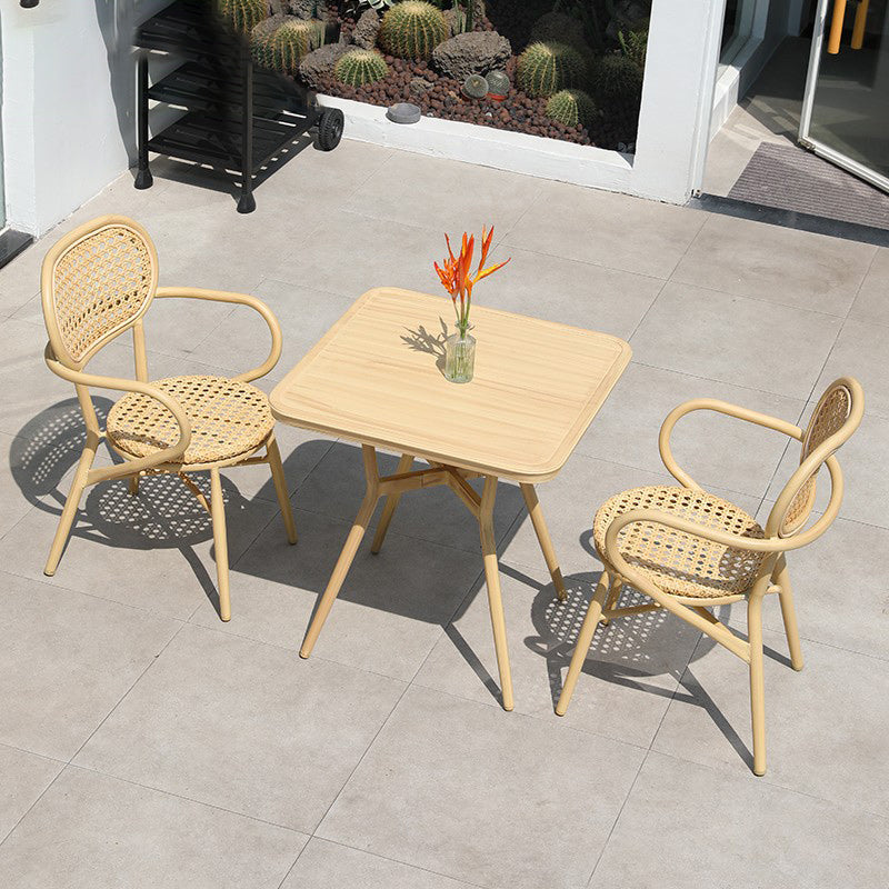 Contemporary Natural Patio Dining Side Chair with Faux Rattan Back