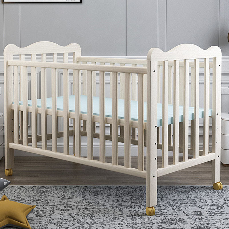 Farmhouse Wooden Baby Crib with Guardrail and Casters in Pine Wood