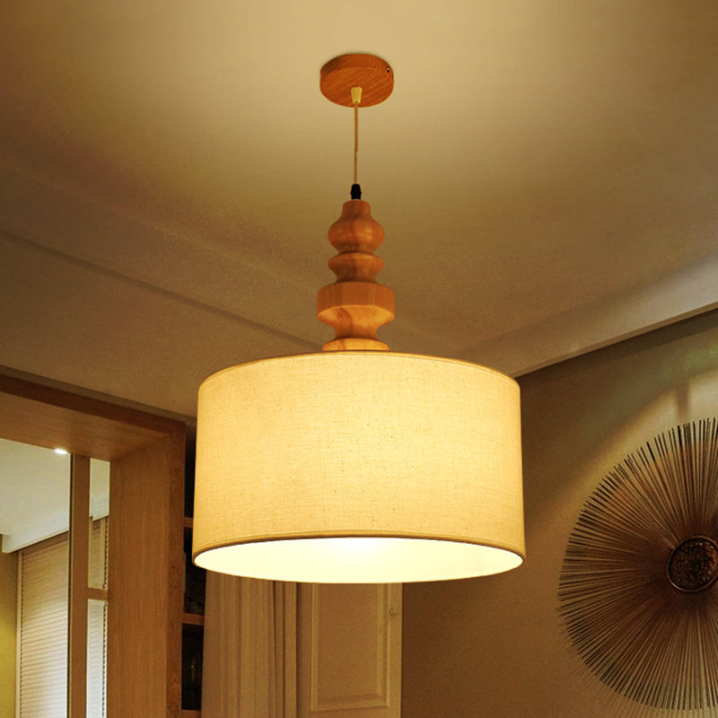 Lampada a 1 tana minimalista a 1 tana ciondolo a goccia di tamburo bianco con tonalità in tessuto sul tavolo da pranzo