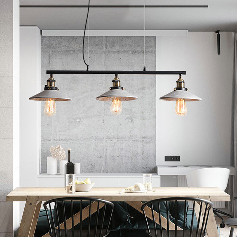 Soucoupe vintage île suspendue légère pendante de plafond de ciment à 3 têtes en gris sur table