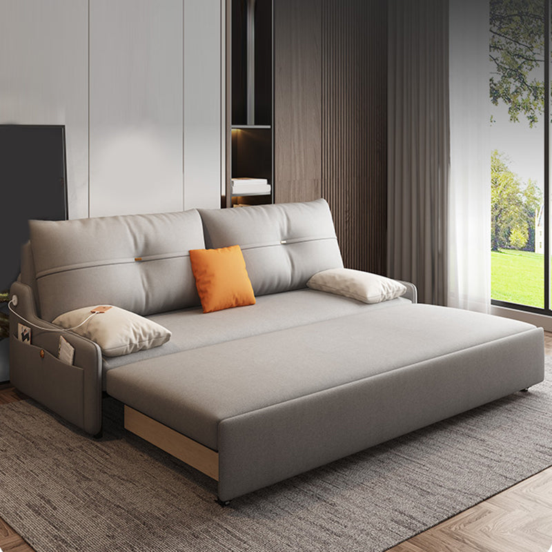 Glam Grey Futon Sleeper Sofa with Tufted Back and Storage in Faux Leather