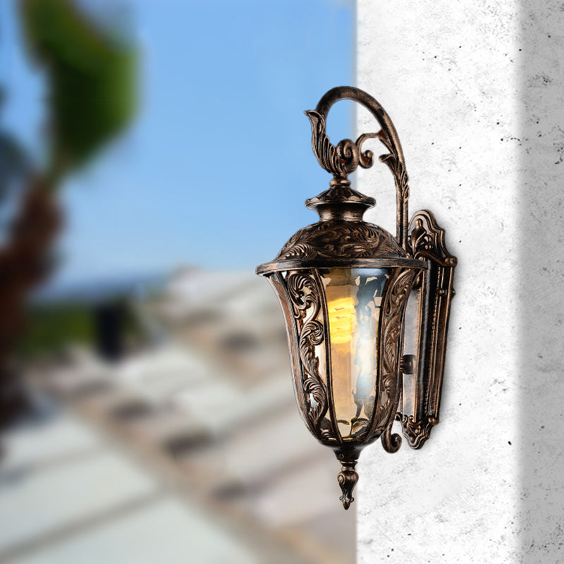 Sconce da parete a braccio curvo in metallo 1 lampada da parete all'aperto leggera in bronzo con tonalità di vetro ambra