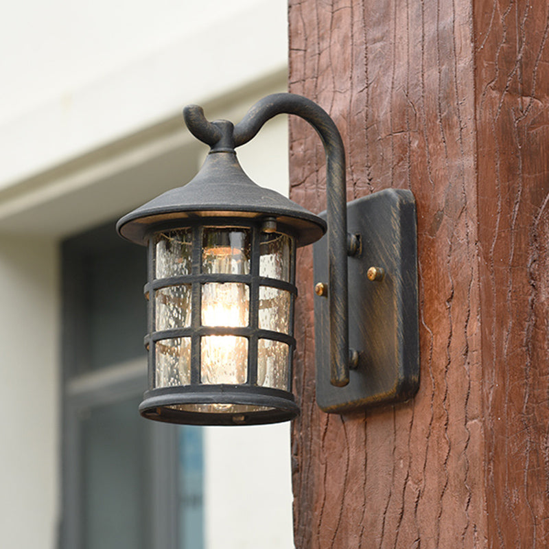 Geplaatste glazen lantaarn wandlamp platteland een lichte buitenmuurlicht in brons/zwart