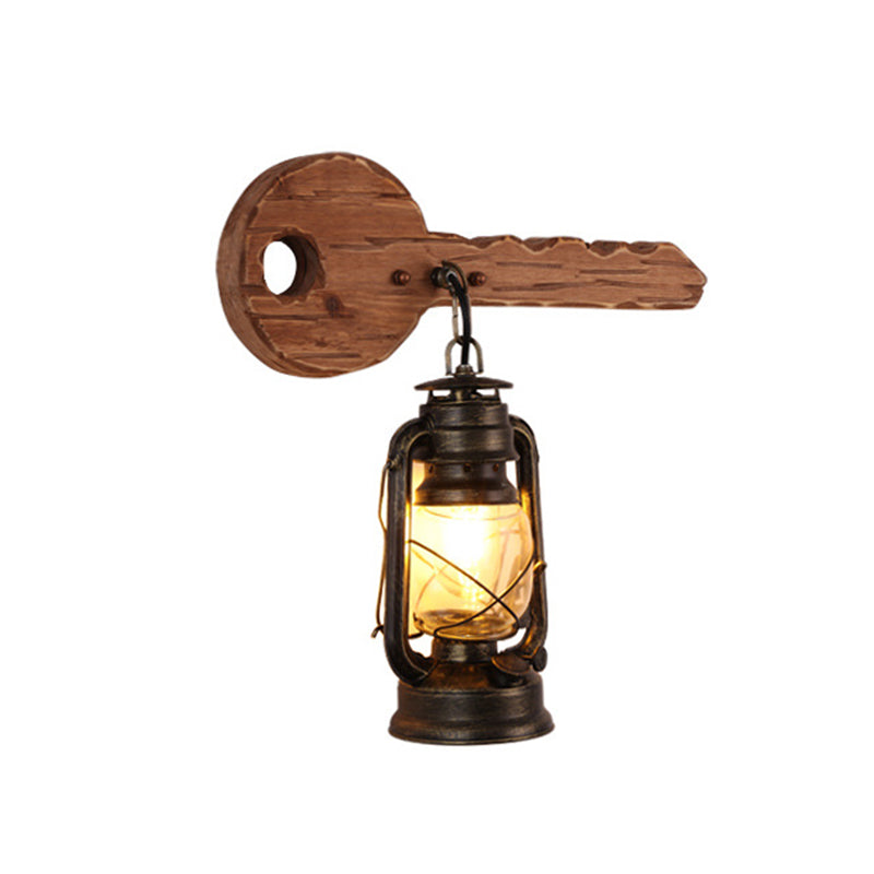 Kerosene Dining Room Wall Lighting Fixture Antiqued Clear Glass 1-Head Brown Sconce with Wood Leaf/Key Backplate