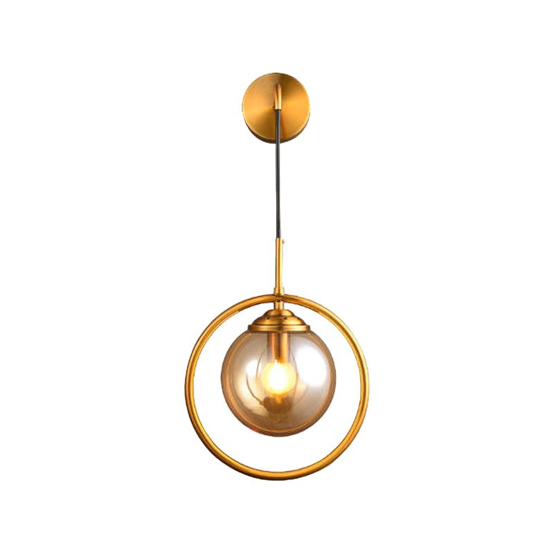 Metal Ring Sconce Lighting Modern 1-Bulb Brass Wall Mounted Lamp with Sphere Tan Glass Shade for Bedside