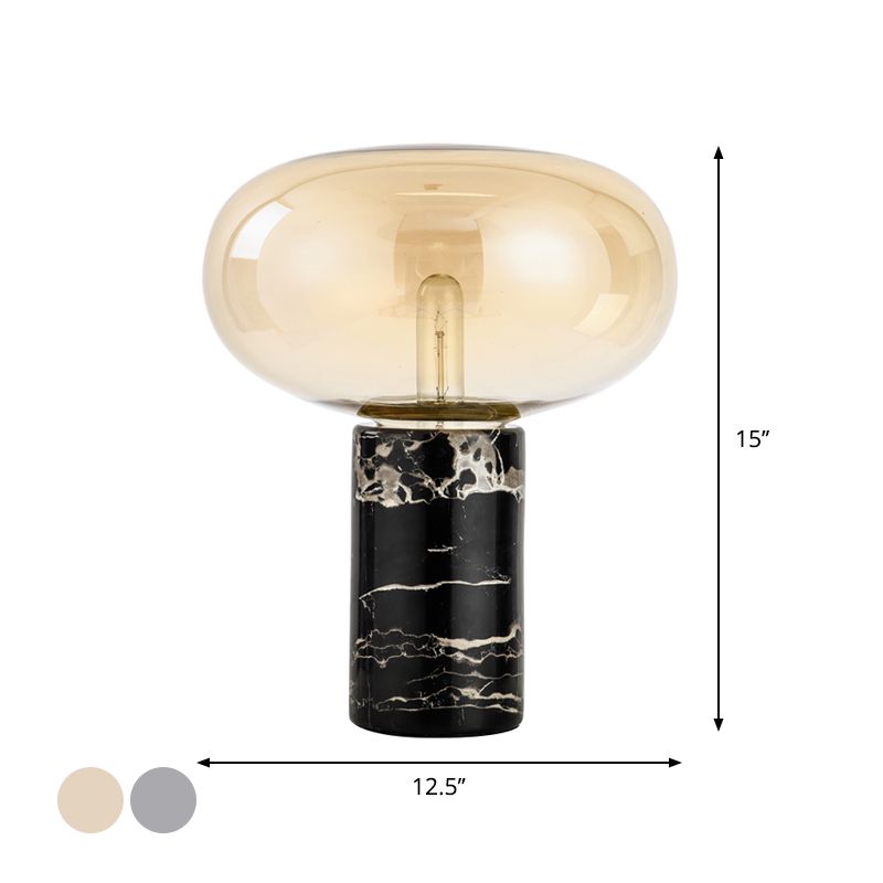 Lampada da tavolo da soggiorno ovale postmoderna in vetro grigio/ambra con 1 lampadina con base cilindrica in marmo nero