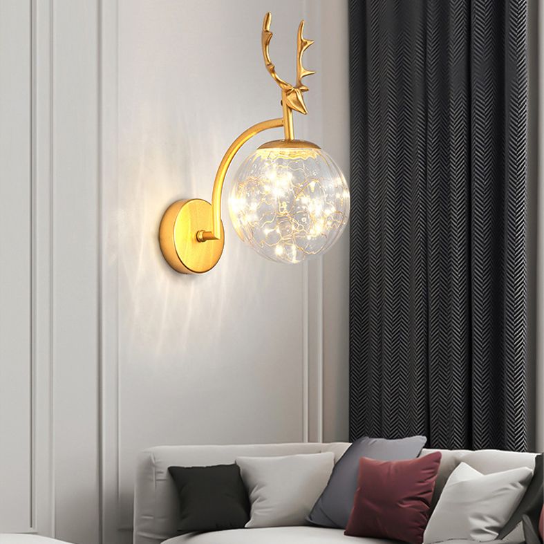 Glass Globe LED Wall Lamp in Modern Fashionable Wrought Iron Wall Sconce with Antler Decoration