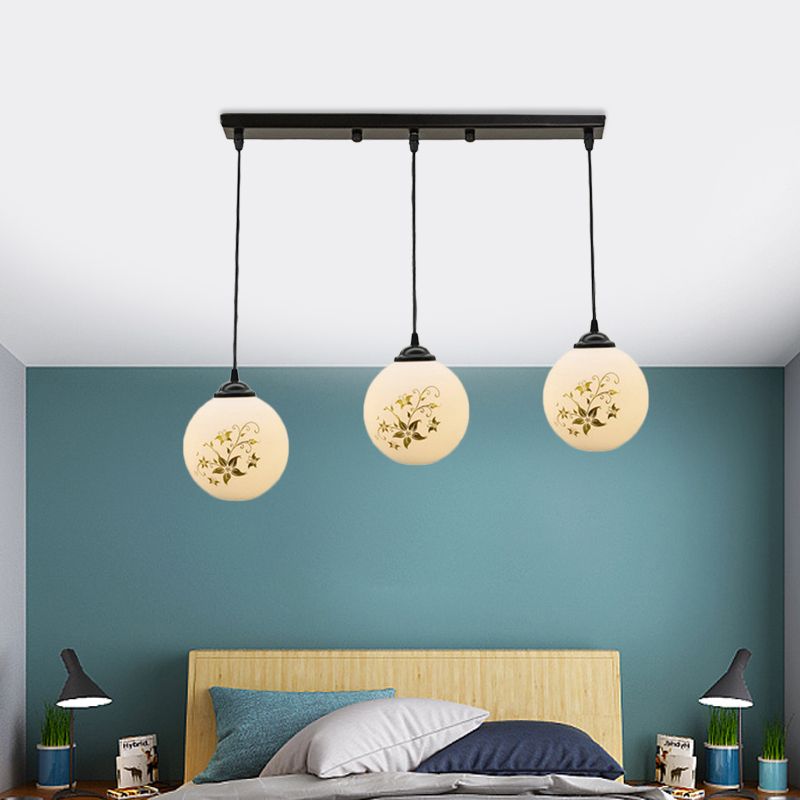 Black Sphere Multi Ceiling Lamp Modernism White Printing Glass 3-Light Dining Room Pendant with Round/Linear Canopy