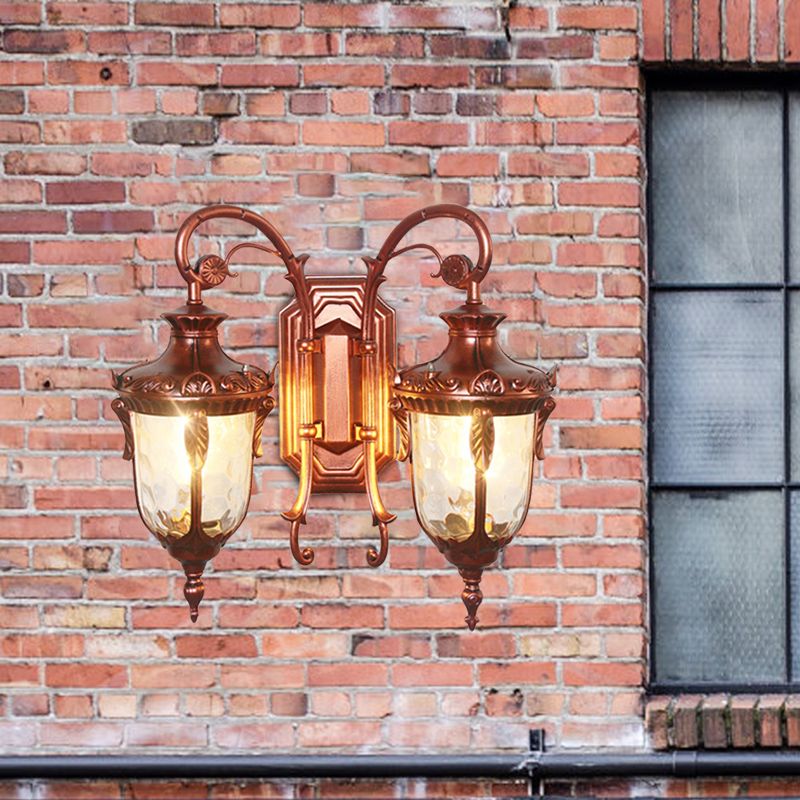 2-Bulb Clear Glass Wall Light Countryside Black and Gold/Copper Urn Courtyard Wall Sconce Lighting