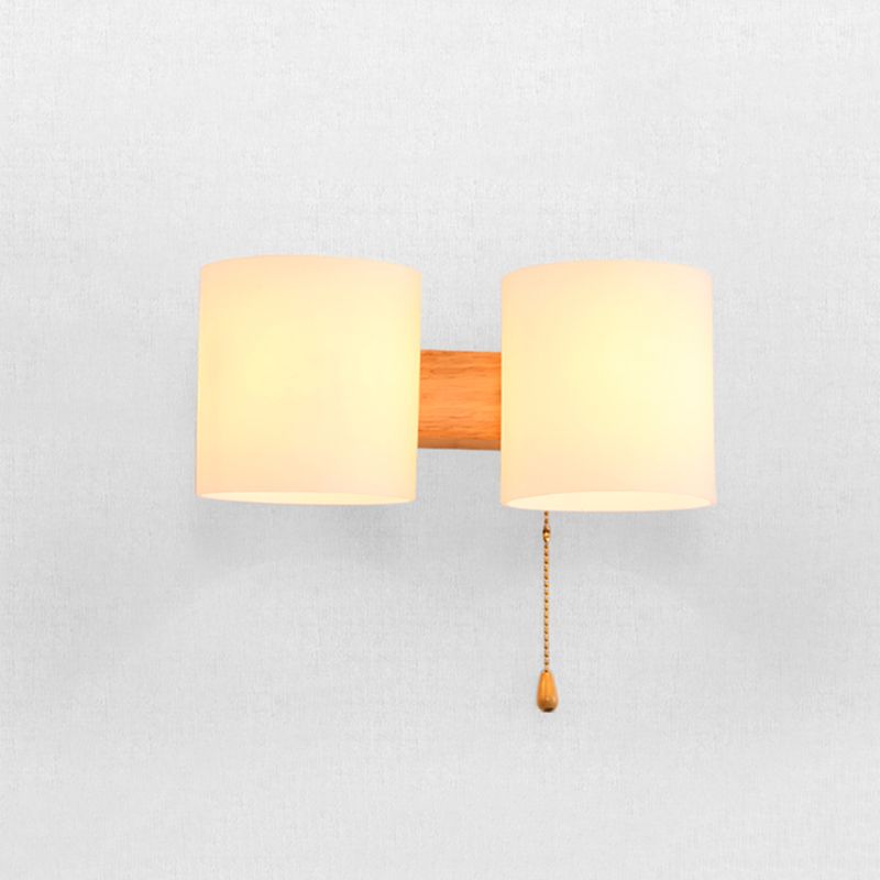 Application murale cylindroïde en bois dans la lampe murale en verre blanche de style concis moderne dans la couleur du journal