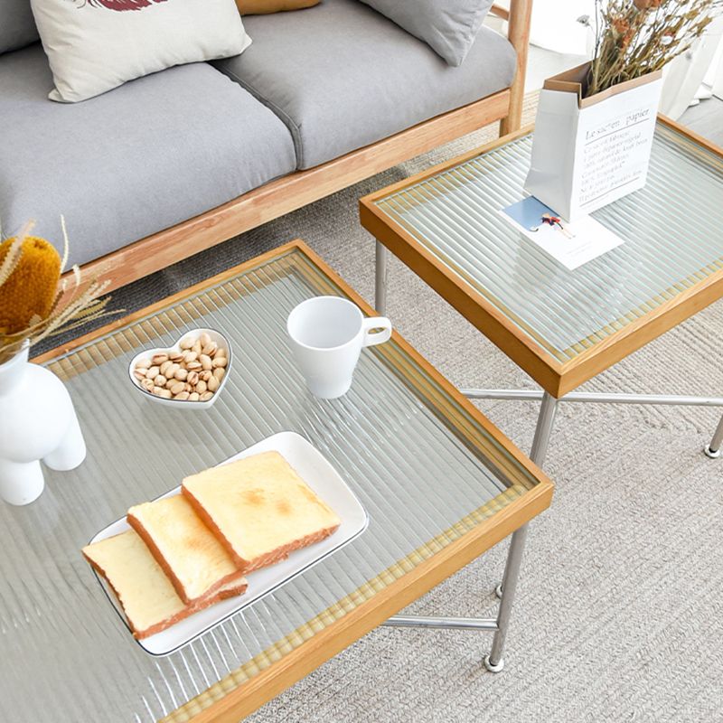 Scandinavian Glass Coffee Table with Wood Accents Cross Legs Cocktail Table