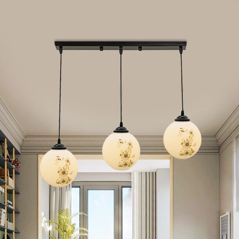 Black Sphere Multi Ceiling Lamp Modernism White Printing Glass 3-Light Dining Room Pendant with Round/Linear Canopy