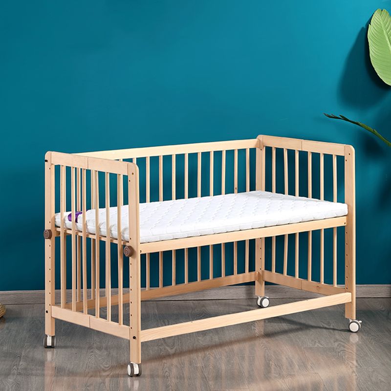 2-in-1 Folding Wooden Crib Natural Baby Crib with Mattress and Casters