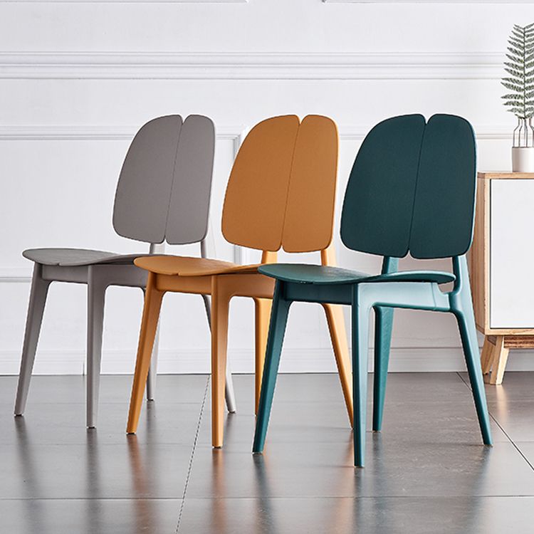 Sillas de comedor y decorativas contemporáneas Silla lateral de plástico con respaldo abierto para interiores y exteriores