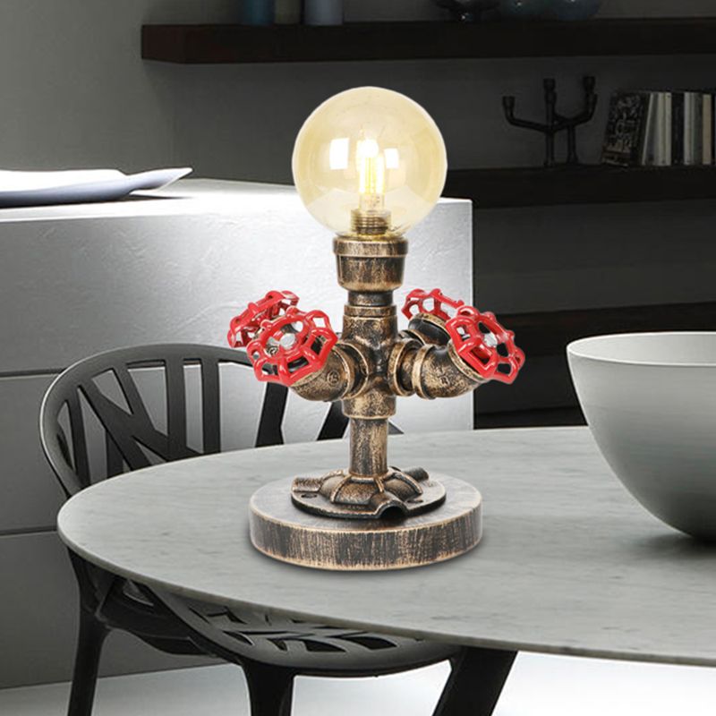 Lampada da lettura a luce singola in argento antico/bronzo. Illuminazione industriale con paralume globo in vetro trasparente/ambrato