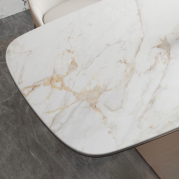 Mesa de comedor de piedra sinterizada de lujo con pedestal de metal en oro rosa