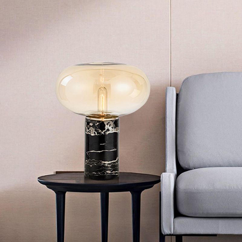 Lampada da tavolo da soggiorno ovale postmoderna in vetro grigio/ambra con 1 lampadina con base cilindrica in marmo nero