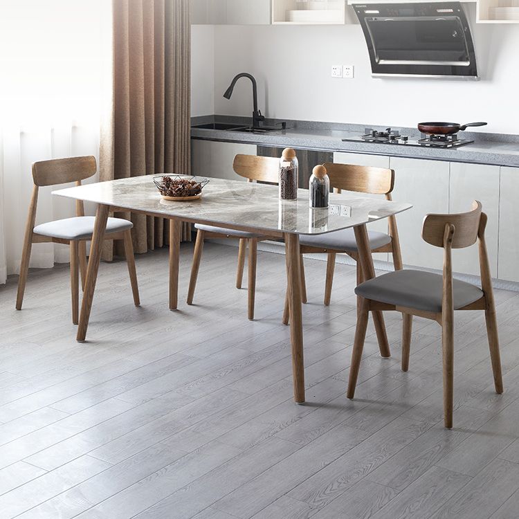 Eenvoudig gesinterde stenen eettafel 4 benen houten basis rechthoektafel voor thuis