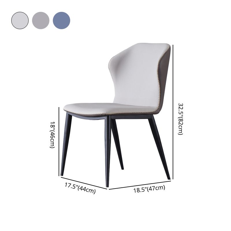 El lado sin brazos del diseño contemporáneo preside el cuero que cena la silla lateral