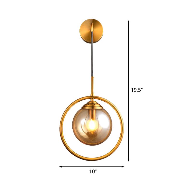 Metal Ring Sconce Lighting Modern 1-Bulb Brass Wall Mounted Lamp with Sphere Tan Glass Shade for Bedside