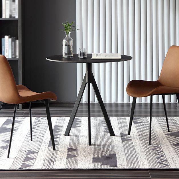 Moderne stijl gesinterde stenen eettafel zwarte ronde tafel met 3 poten