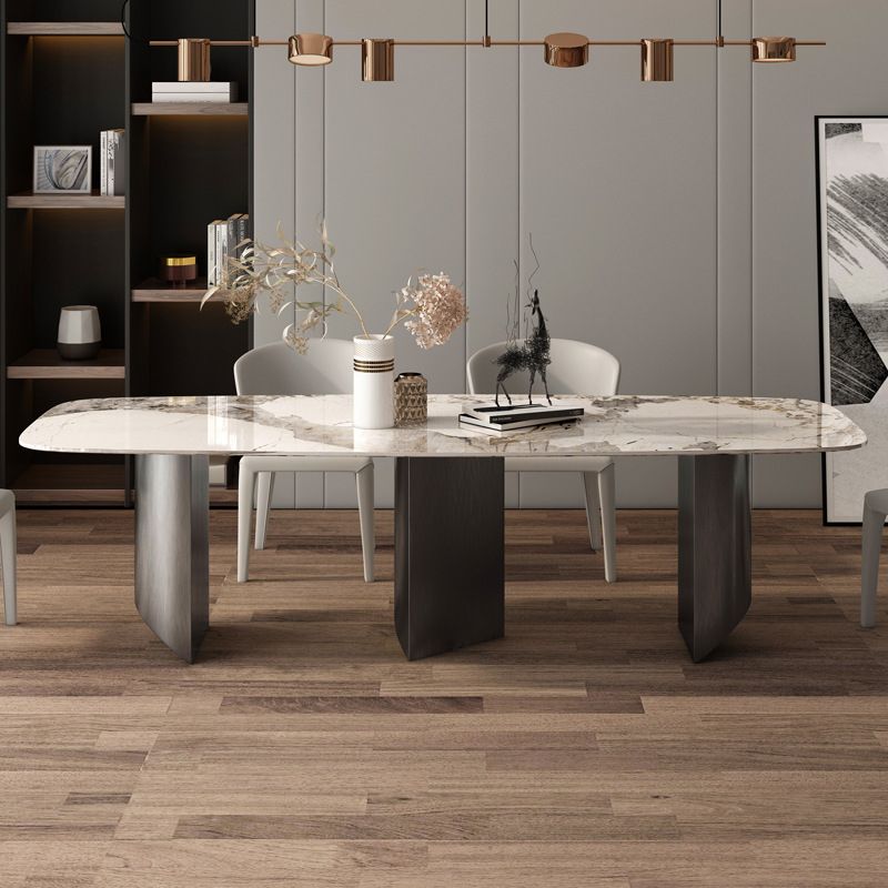 Set da pranzo in pietra sinterizzato in stile minimalista con tavolo fisso bianco e doppia base di piedistallo grigio