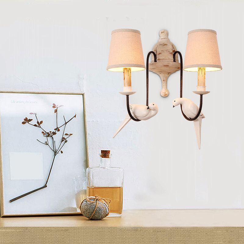2 Heads Barrel Wall Lighting Fixture Traditional Beige Fabric Wall Sconce Light with Curved Arm and Bird Decor