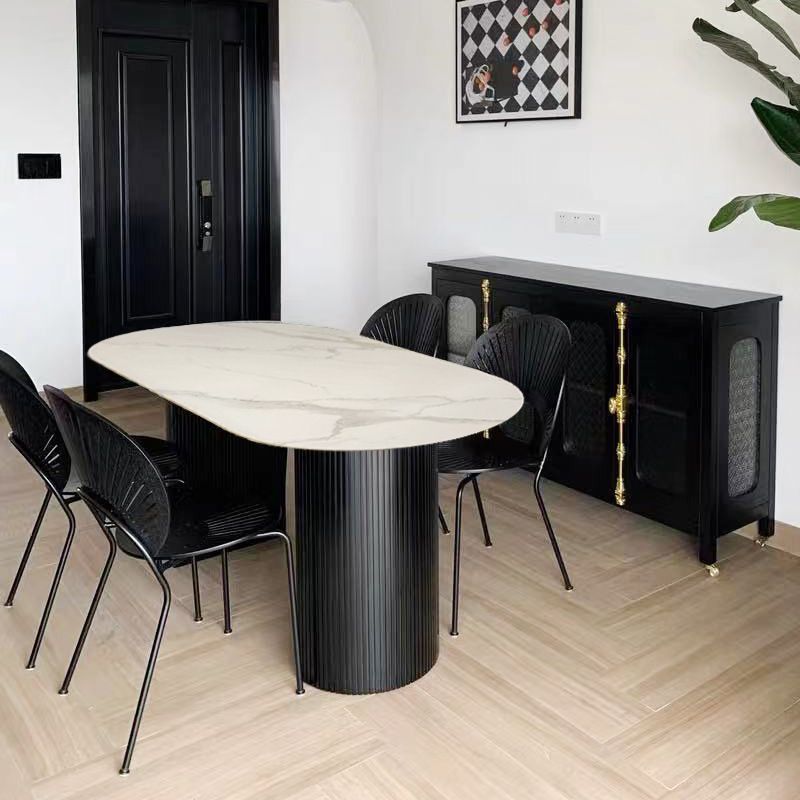Table à manger en pierre fritrée de style moderne avec une double base de piédestal double