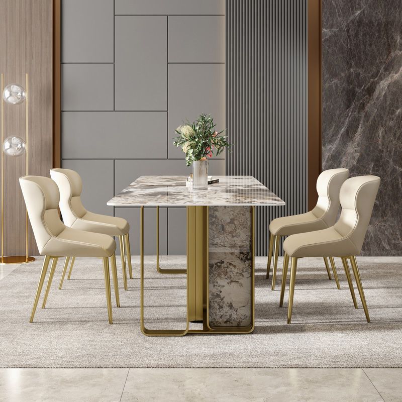 Mesa de comedor rectangular de piedra sinterizada de lujo con pedestal doble dorado