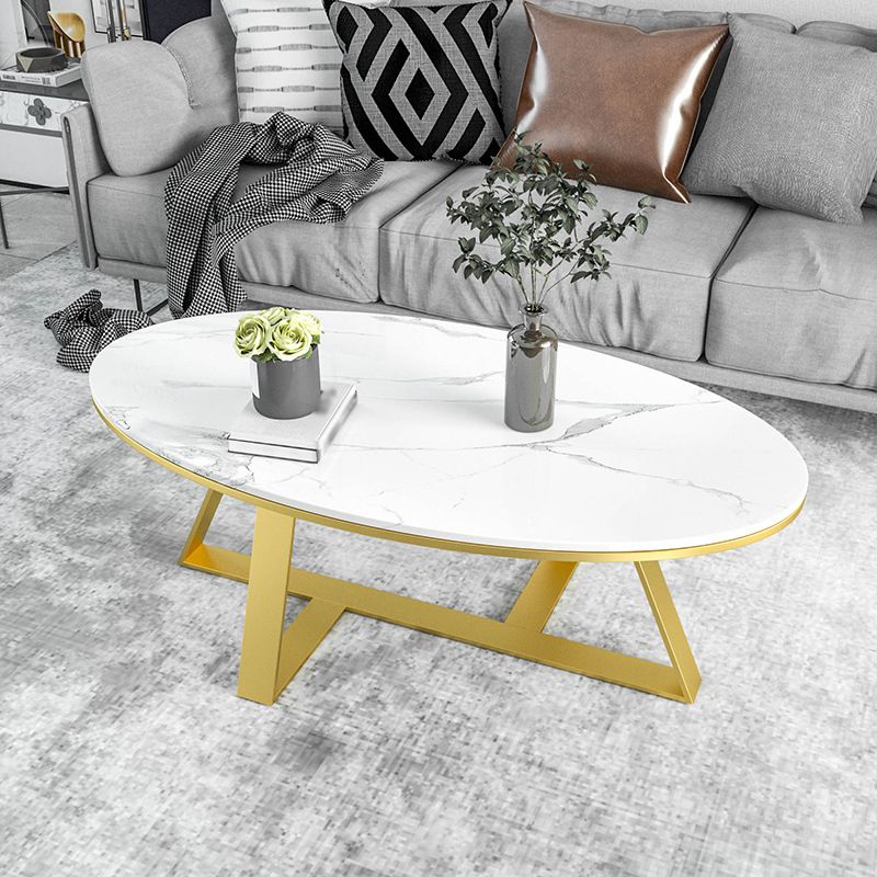 Oval Coffee Table with a Black/gold Base Made of Marble and Wrought Iron