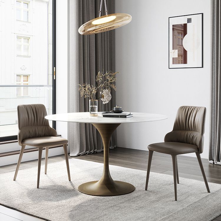 Dinettetafel in eigentijdse stijl, rond stenen meubilair met tulponderstel