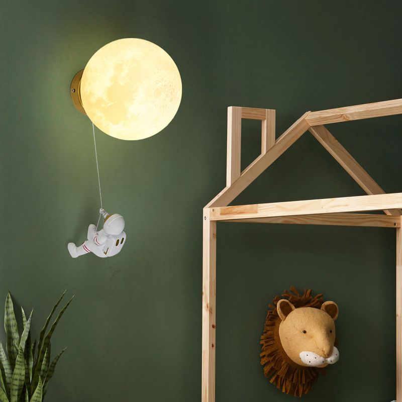 Lampada da parete astronauta e piante