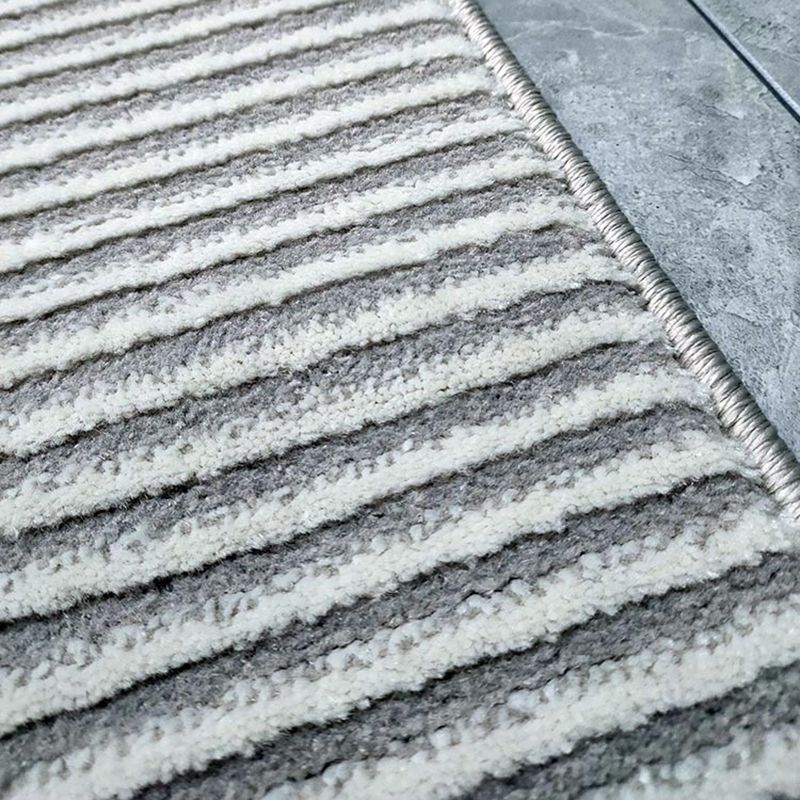Alfombra moderna de gris claro poliéster alfombra marginada irregular alfombra lavable para sala de estar