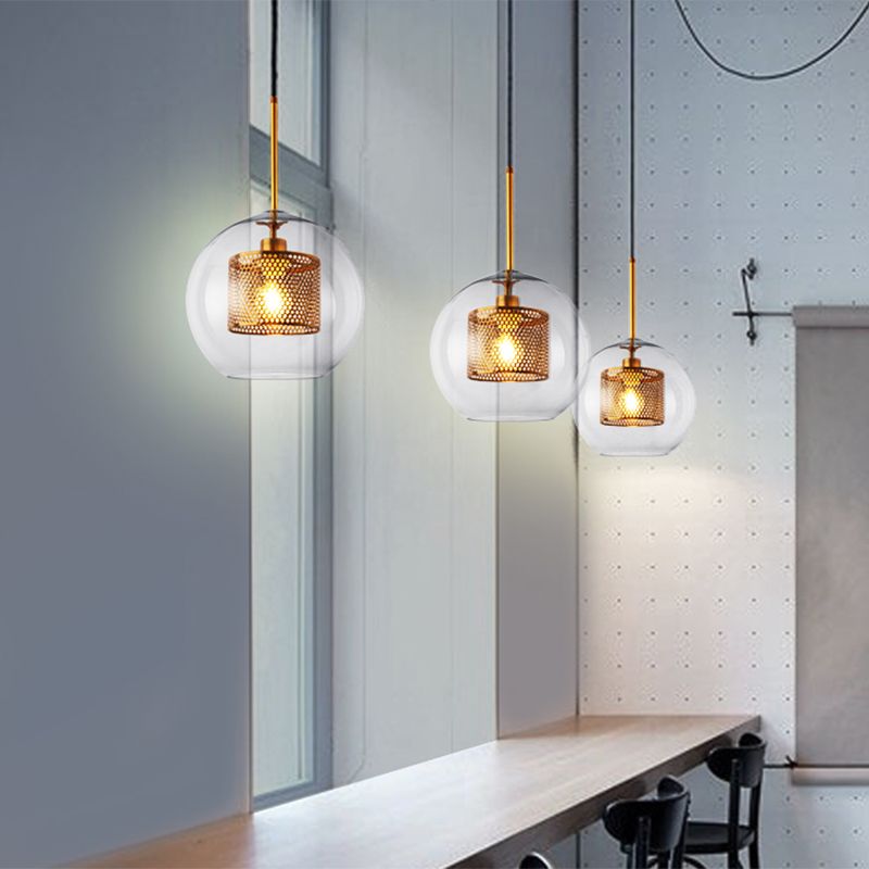 Éclairage de pendentif rond unique contemporain avec une teinte en verre transparent