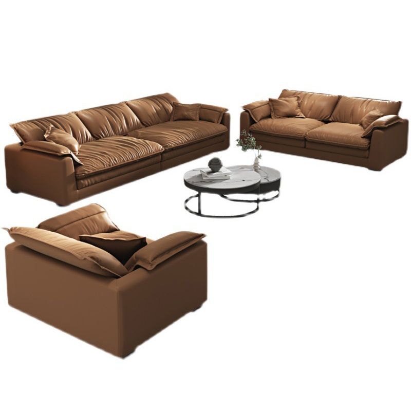 Glam Style Sofa Bed with Sponge Upholstery Filled Orange Faux Leather Sofa