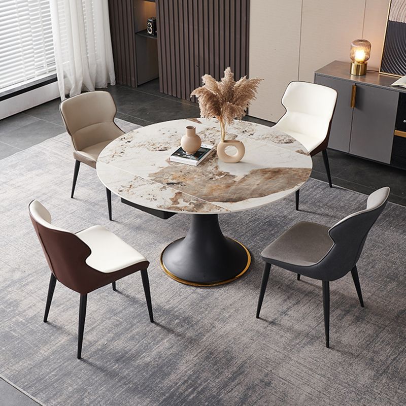 Mesa de comedor de piedra sinterizada de lujo con base de metal negro