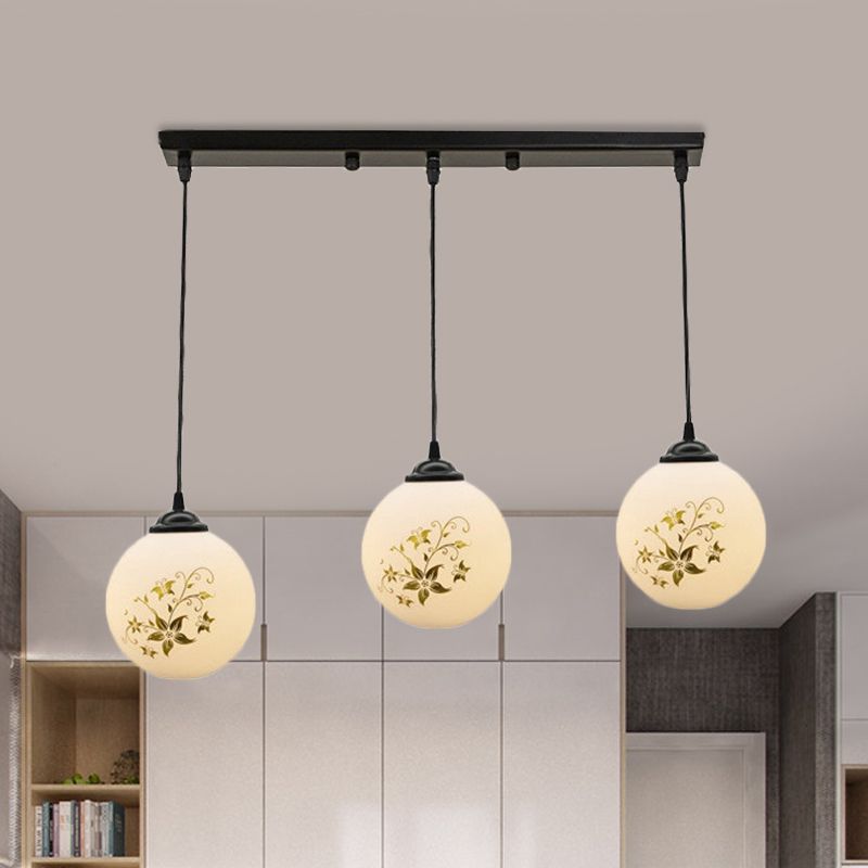 Black Sphere Multi Ceiling Lamp Modernism White Printing Glass 3-Light Dining Room Pendant with Round/Linear Canopy