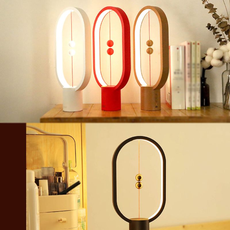 Lampada da tavolo ovale in stile moderno colorato lampada da scrivania a led singola per camera da letto