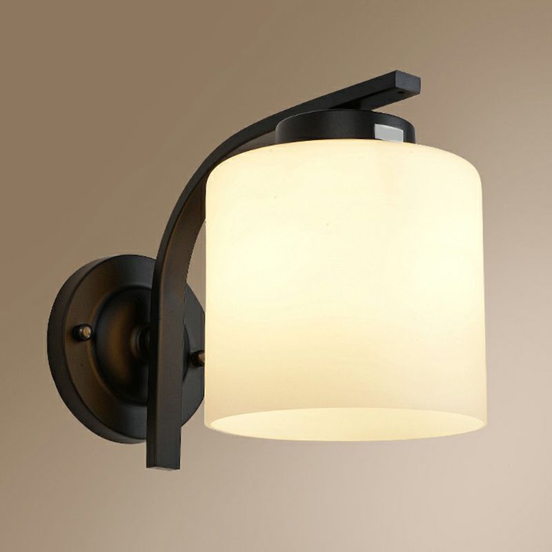 Luz de pared de cilindro de vidrio blanco Simplicidad 1 Lámpara de apliques de sala de estar de cabeza en negro