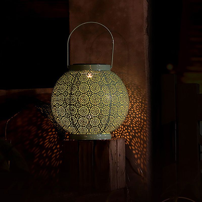 Sphere Hollowed Out Solar Table Lamp Simple Stylish Metal Garden LED Ground Light with Handle in Green