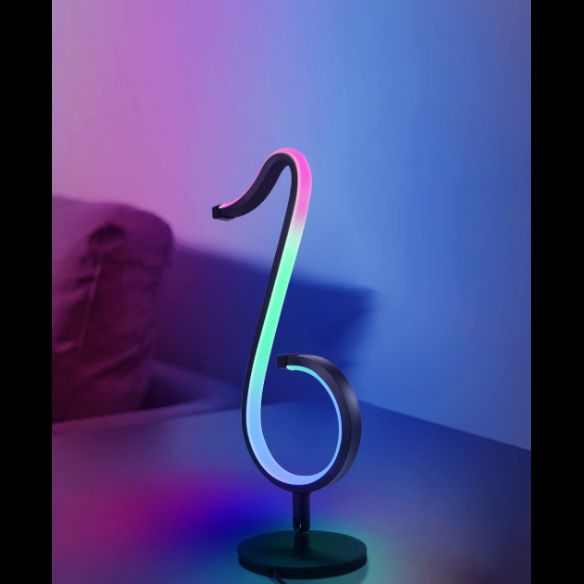 Lampada da tavolo a forma di nota musicale in metallo. Luce notturna a LED nera minimalista alla moda per camera da letto