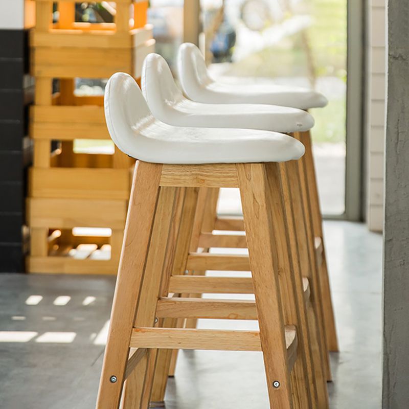 Taburete de bar interior de cuero contemporáneo de madera maciza con respaldo bajo