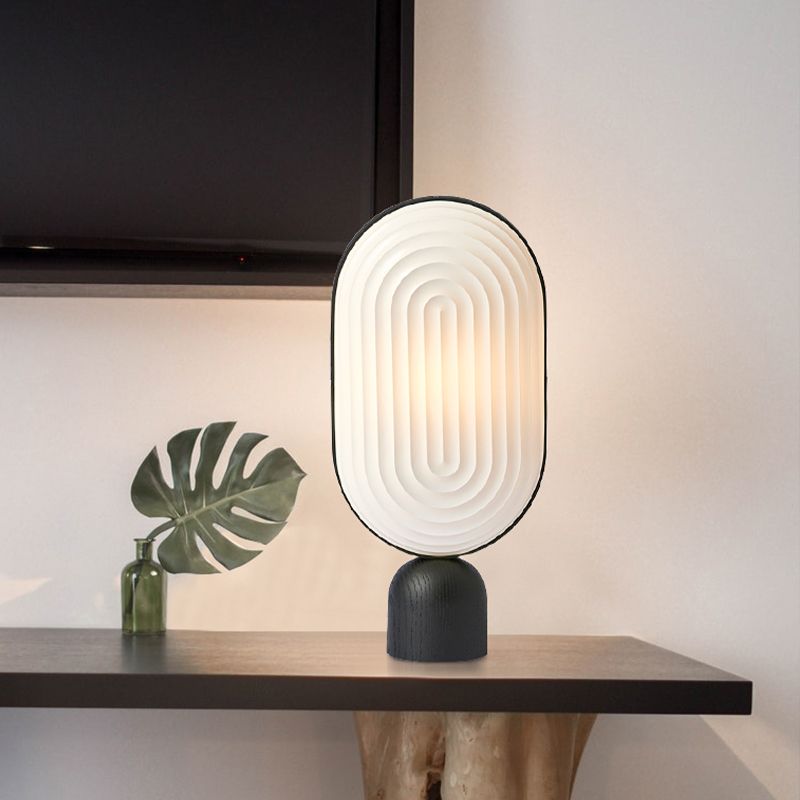 Zeitgenössische LED -Nachttischlampe Weiß längliches Lesebuch Licht mit Harzschatten