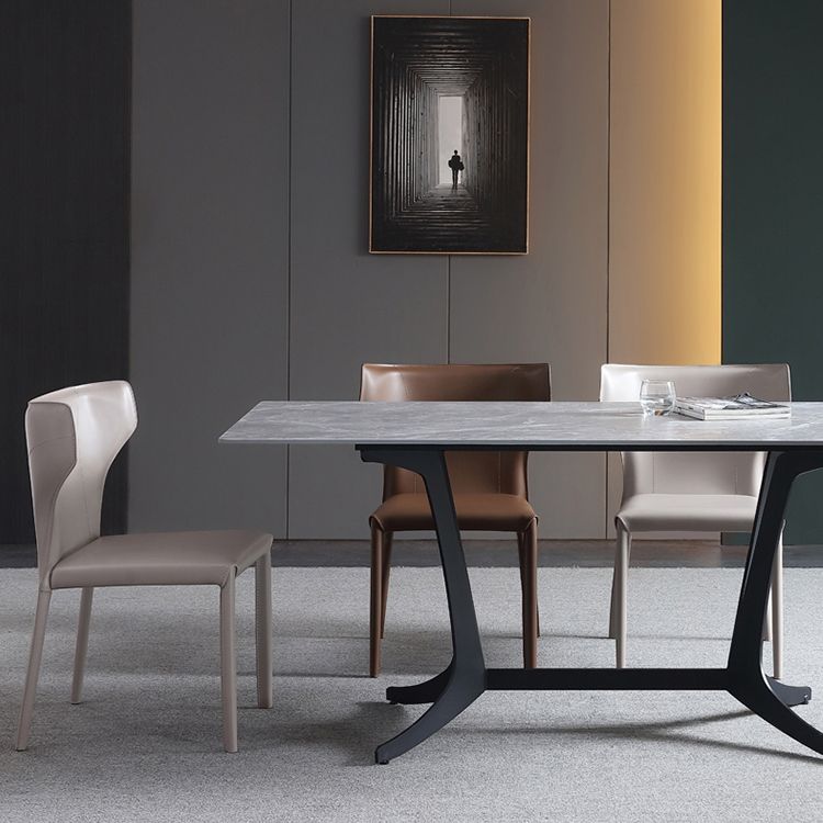 Silla lateral de comedor de cuero de estilo diseñador Silla de comedor Wingback para uso doméstico