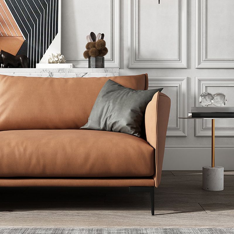 Salle de salon à armoine carré canapé orange standard avec coussins